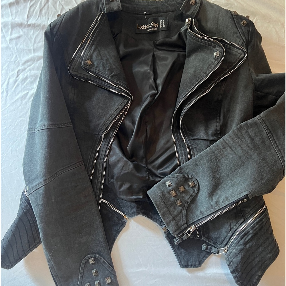 Studded faded black jean jacket. Wore once